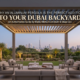 A modern motorized louvered aluminum pergola in a luxurious Dubai backyard with outdoor furniture, integrated LED lighting, and a view of the Burj Khalifa and the Dubai skyline.