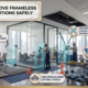 Professional workers wearing safety gear and using heavy duty suction tools to safely remove a frameless glass partition in a Dubai office